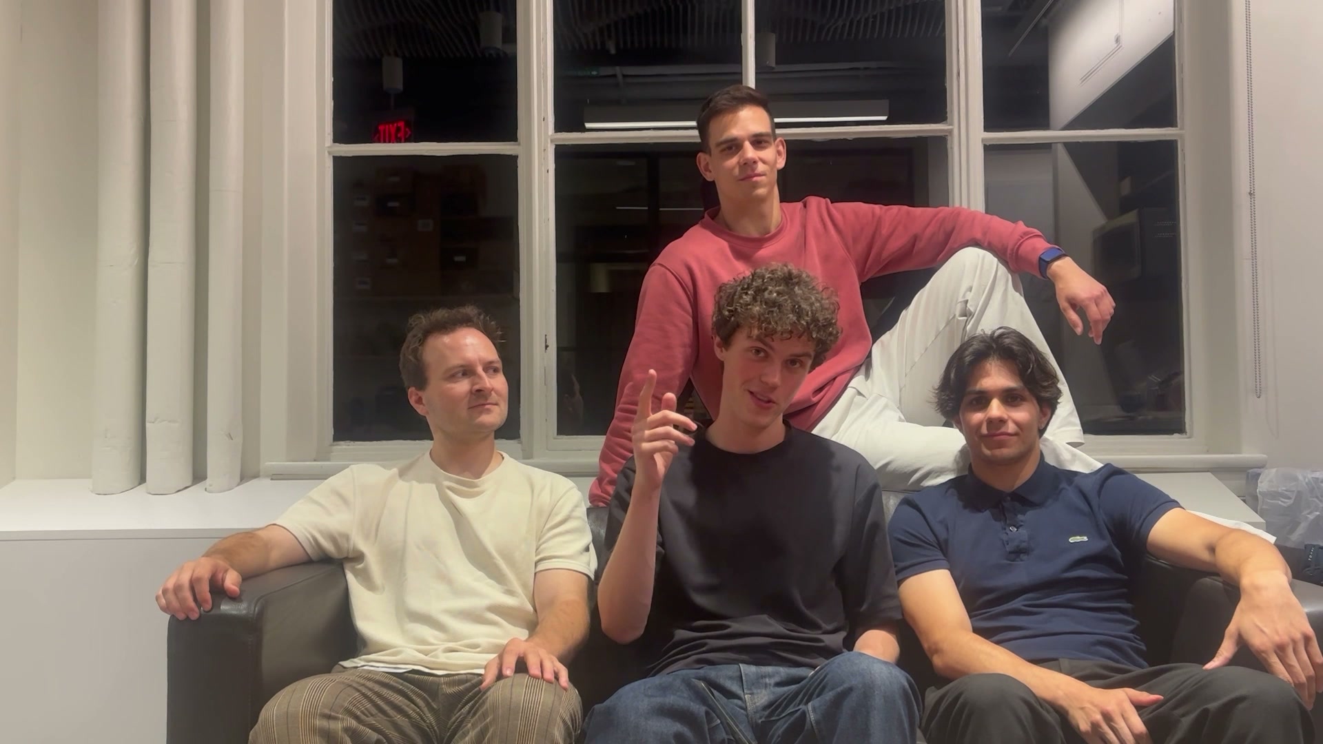 The four AMBR teammates seated together in the hackathon team video